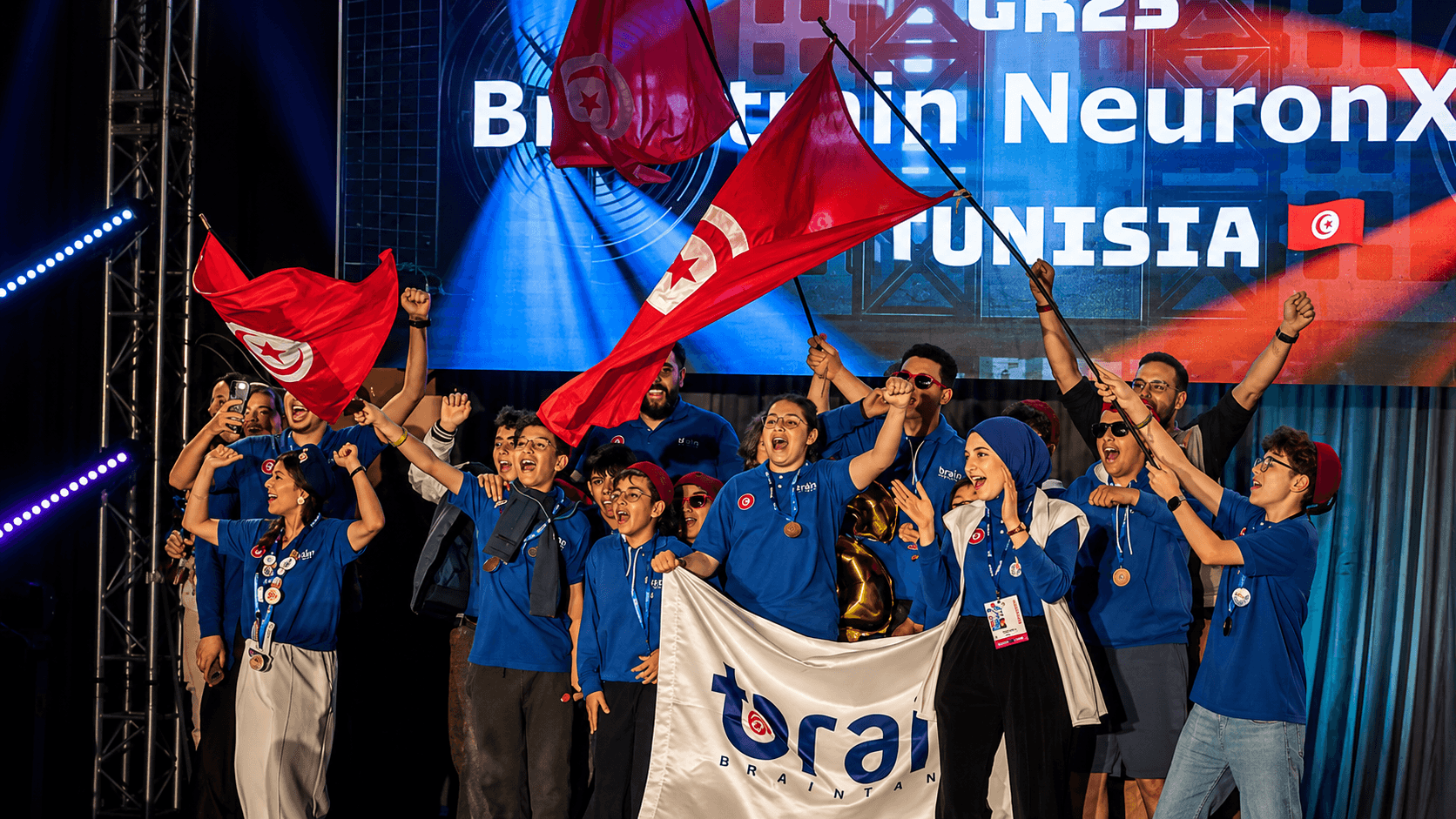 BrainTrain students and mentors celebrating with their competition trophies
